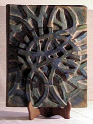 ATOMO - bassorilievo in ceramica patinata a cera 30x40